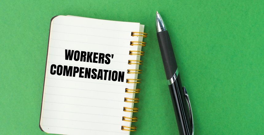 pen and notebook with the words workers' compensation